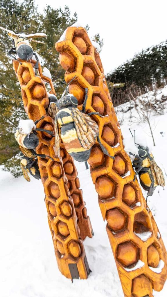 bees and honeycomb sculpture in snow